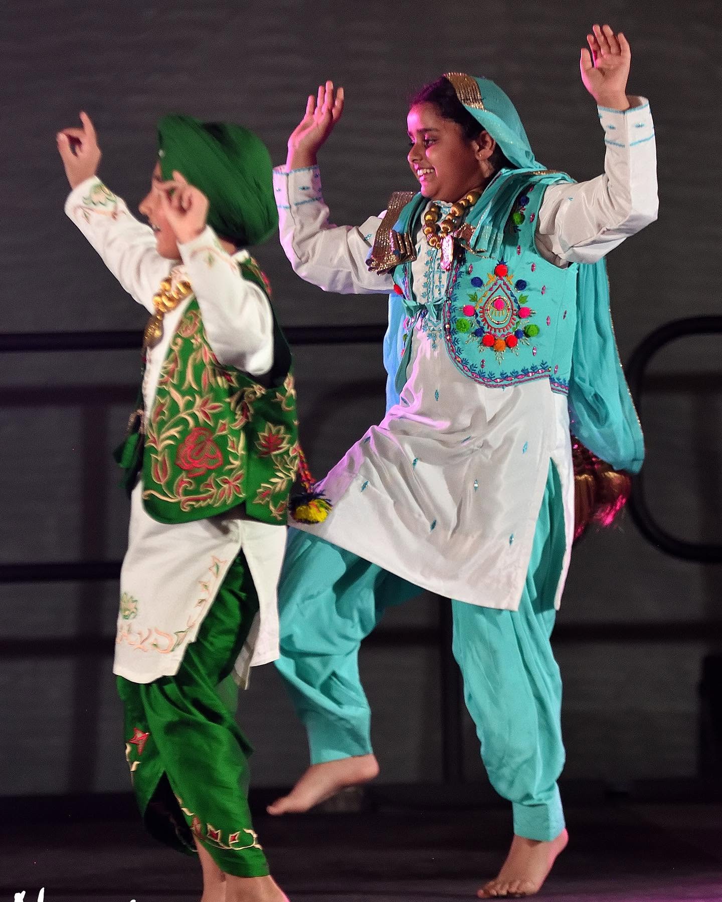 KC Bhangra students performing in traditional costume