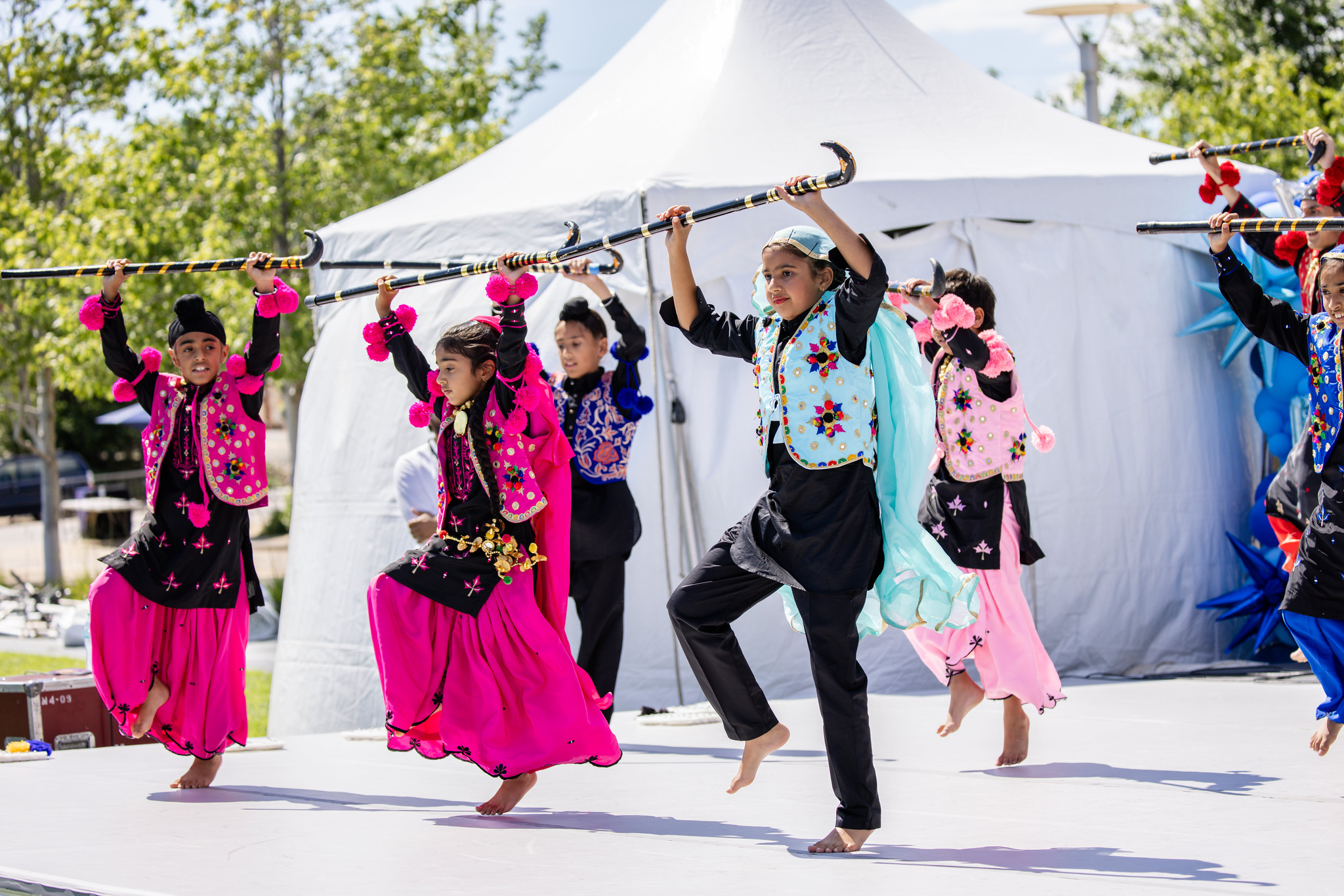 KC Bhangra kids performing with staffs